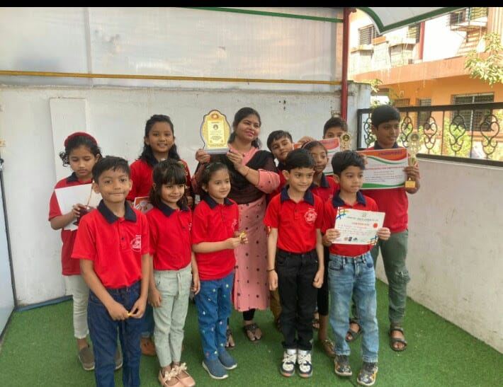Students with trophies and certificates outside school