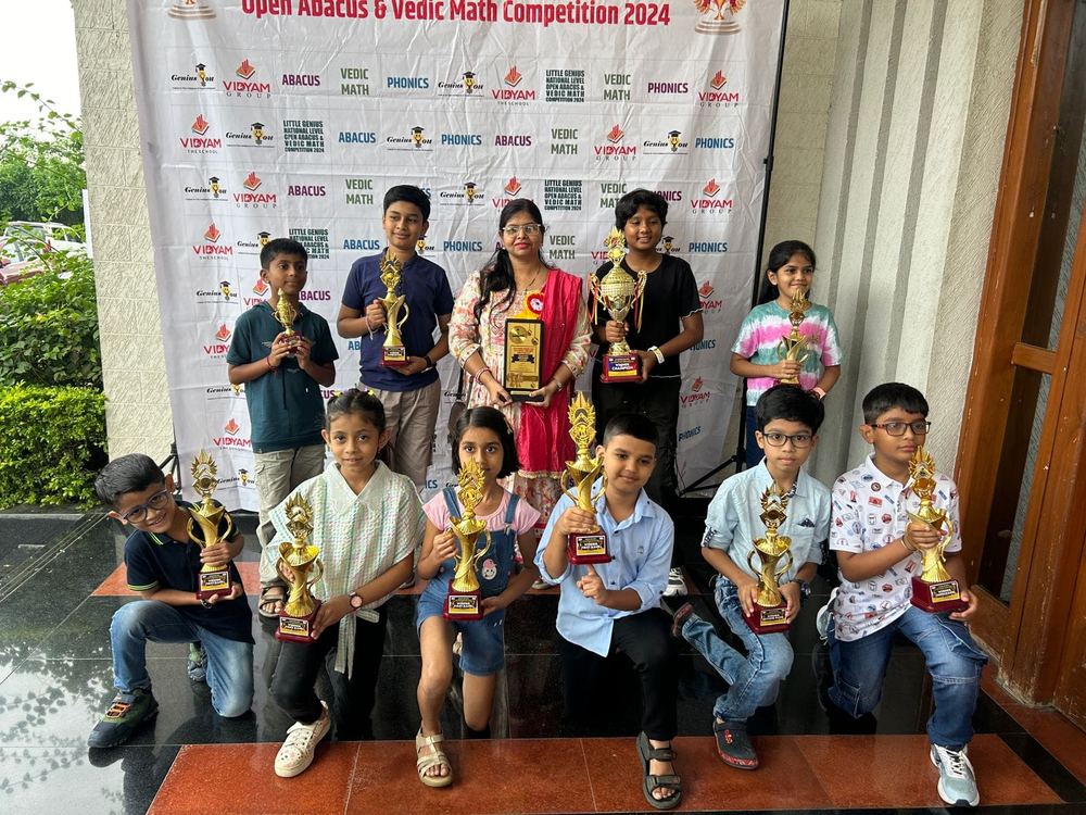 Students with gold trophies at Little Genius National Level Open Abacus & Vedic Math Competition 2024
