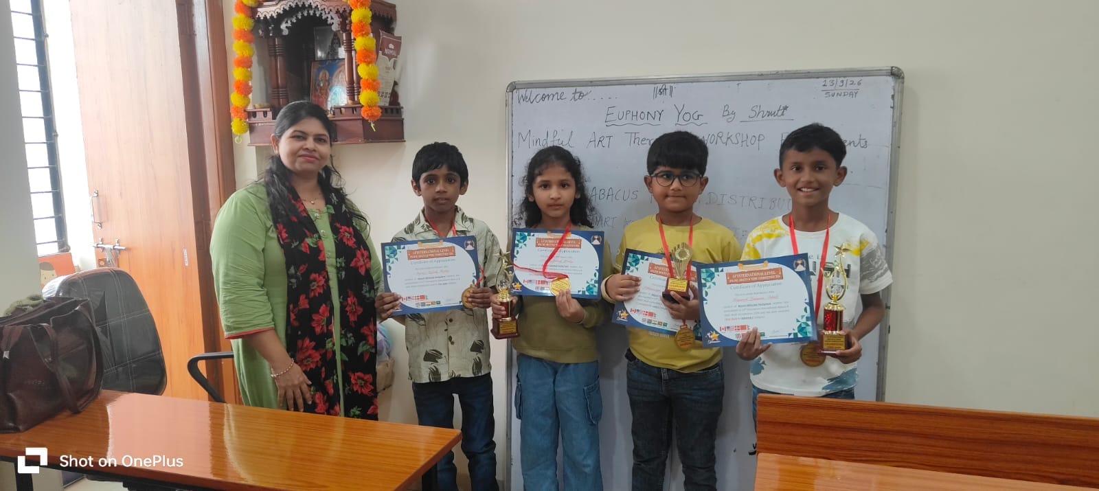 Mayuri Pachghare with students holding trophies and certificates at 14th National Level Abacus Competition prize distribution, Smart Kids Study Circle Manish Nagar Nagpur