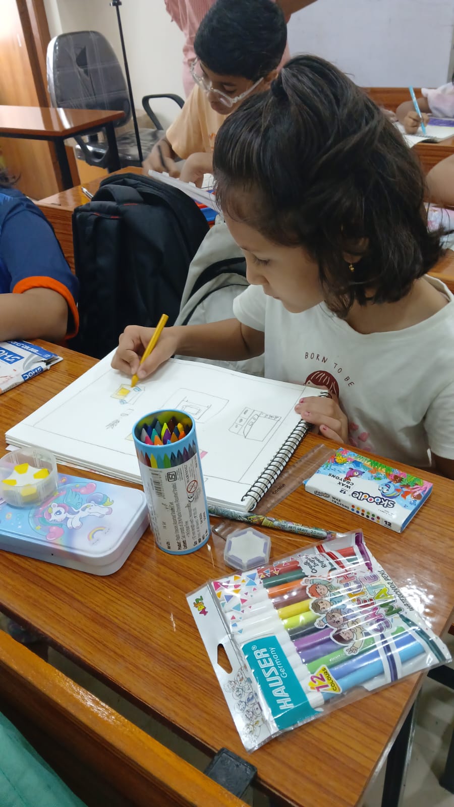 Student using oil pastels at Art Therapy Workshop Smart Kids Study Circle Nagpur